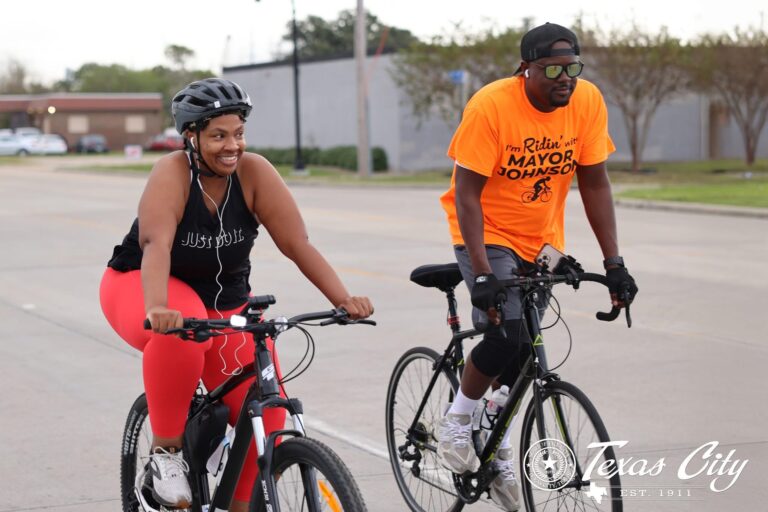Riding alongside a resident in the first annual Mayor’s Bike Ride, connecting with our community and promoting active living.
